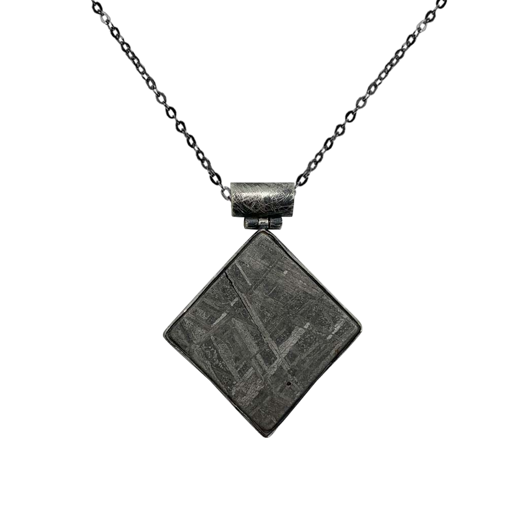 Irregular-shaped meteorite pendant with beveled chain cylinder