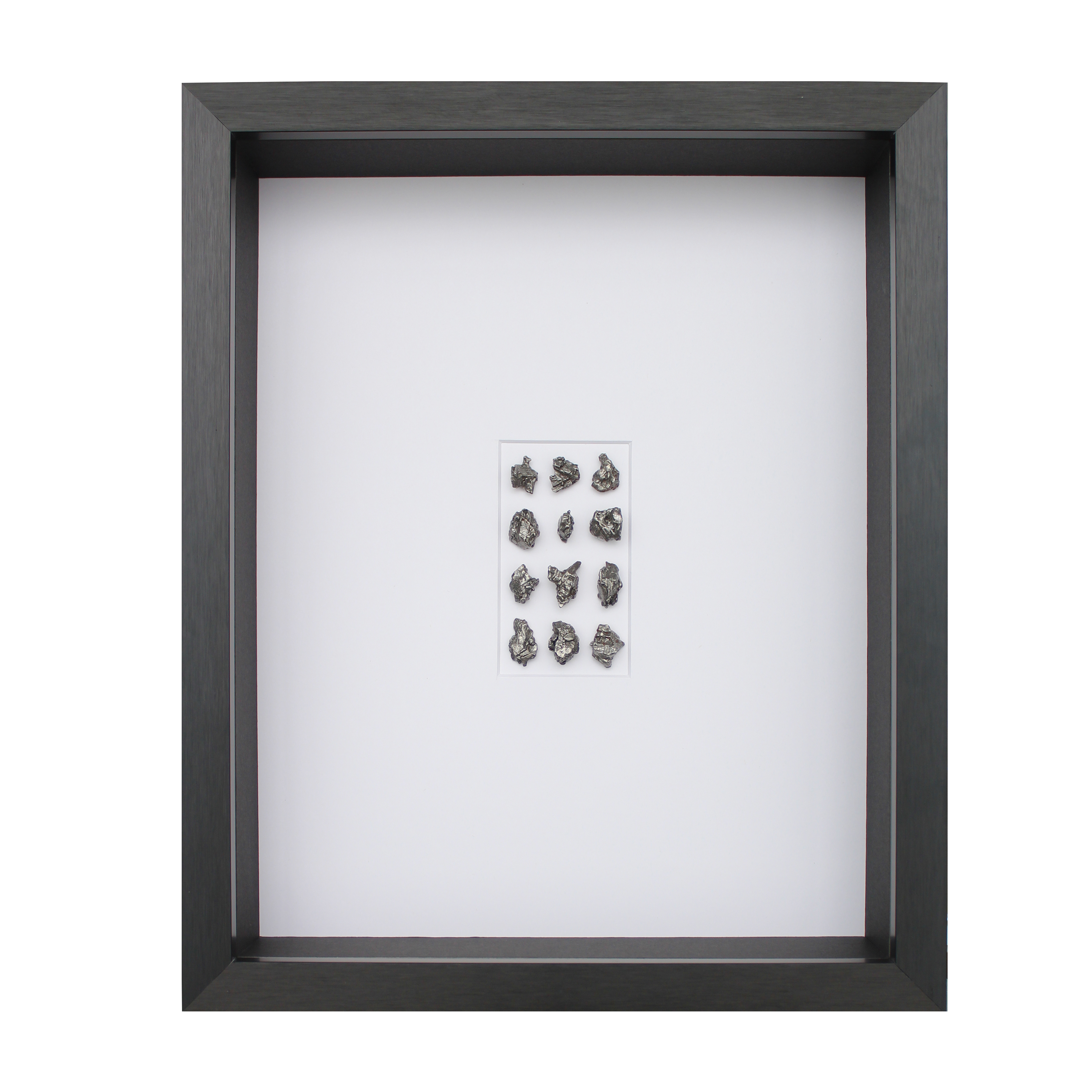Frame with 70-80 grams of meteorite, black aluminum frame.